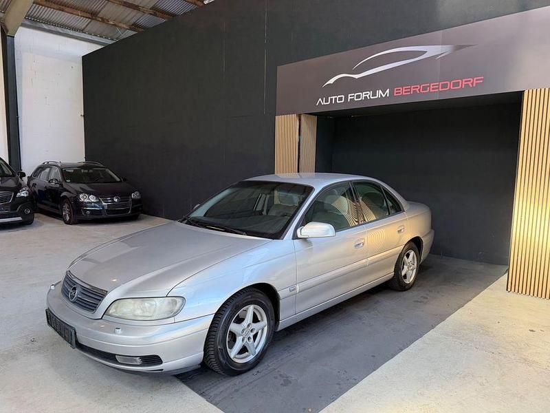 Second-hand Opel Omega 144 CP (105 kW) 2000 Argintiu Berlinǎ