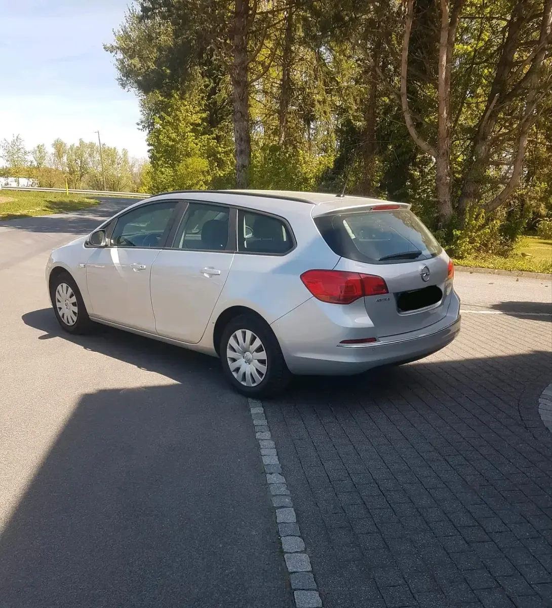 Second-hand Opel Astra 110 CP (80 kW) 2014 Argintiu Break