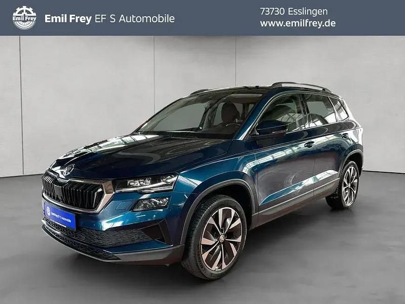 Lavablau metallic Gebraucht 2022 Skoda Karoq Style SUV | 22.890 € - Bild 1/4