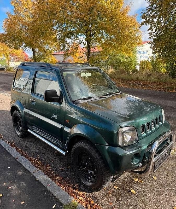 Grün Gebraucht 2003 Suzuki Jimny SUV | 5.999 € (Fairer Preis) - Bild 1/4