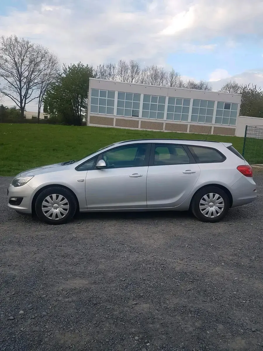 Second-hand Opel Astra 110 CP (80 kW) 2014 Argintiu Break