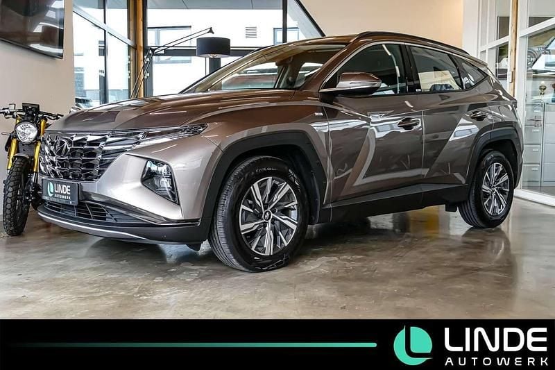 Silky bronze / met Gebraucht 2021 Hyundai Tucson Select SUV | 20.900 € (Superpreis) - Bild 1/4