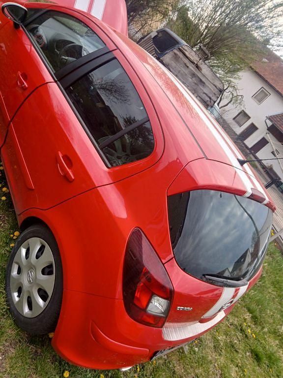 Second-hand Opel Corsa 87 CP (63 kW) 2011 Roșu Hatchback