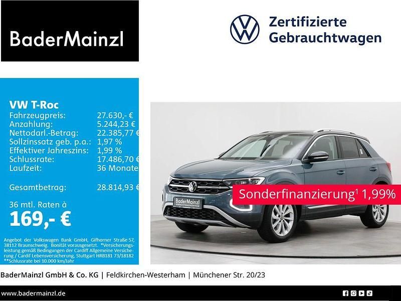 Petroleum blue metallic/schwarz (metallic) Gebraucht 2024 VW T-Roc Style SUV | 27.630 € (Guter Preis) - Bild 1/3