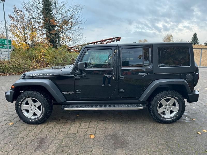 Schwarz Gebraucht 2012 Jeep Wrangler Unlimited Rubicon SUV | 28.500 € (Fairer Preis) - Bild 1/4