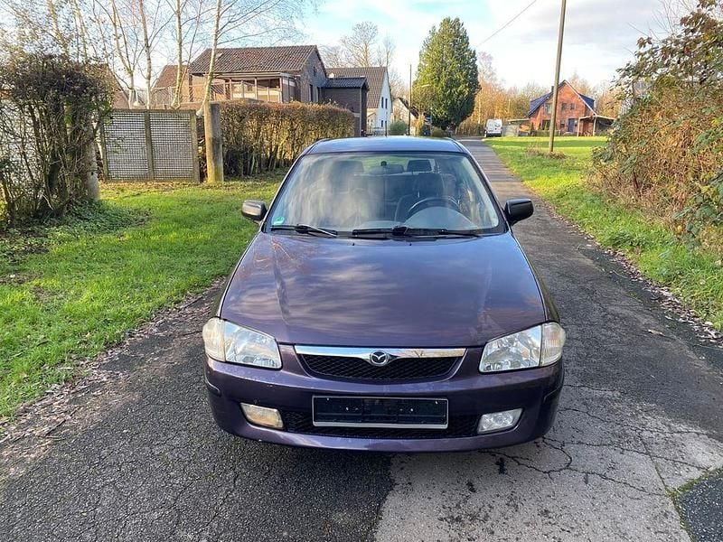 Violett Gebraucht 1999 Mazda 323F Limousine | 2.950 € - Bild 1/4