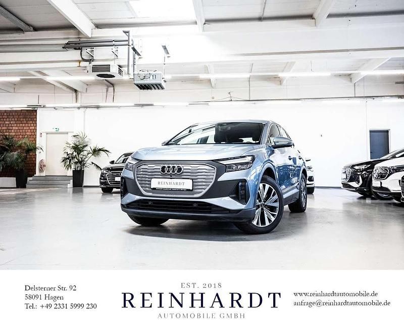 Geysirblau metallic Gebraucht 2023 Audi Q4 Sportback e-tron Comfort SUV | 26.705 € (Guter Preis) - Bild 1/4