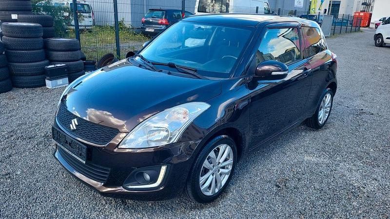 Braun Gebraucht 2015 Suzuki Swift Comfort | 6.980 € (Fairer Preis) - Bild 1/4