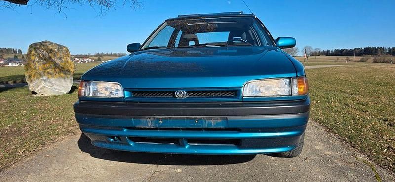 Gebraucht Mazda 323 88 PS (64 kW) 1993 Grün Kleinwagen