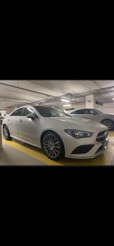 Weiß Gebraucht 2021 Mercedes CLA200 AMG line Coupé | 34.500 € - Bild 1/4