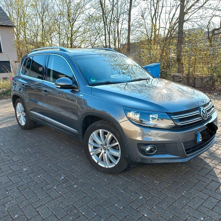 Grau Gebraucht 2014 VW Tiguan Sportline SUV | 9.900 € (Fairer Preis) - Bild 1/4