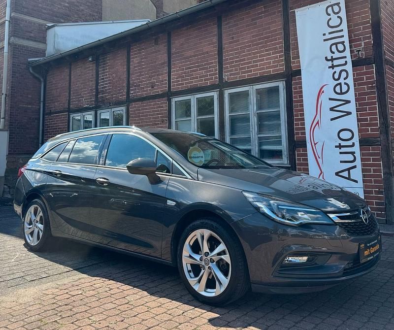 Grau Gebraucht 2016 Opel Astra Dynamic Kombi | 8.999 € (Fairer Preis) - Bild 1/4