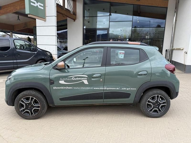 Gebraucht Dacia Spring Extreme 47 kW (65 PS) 2023 Grün flechtengrau Kleinwagen