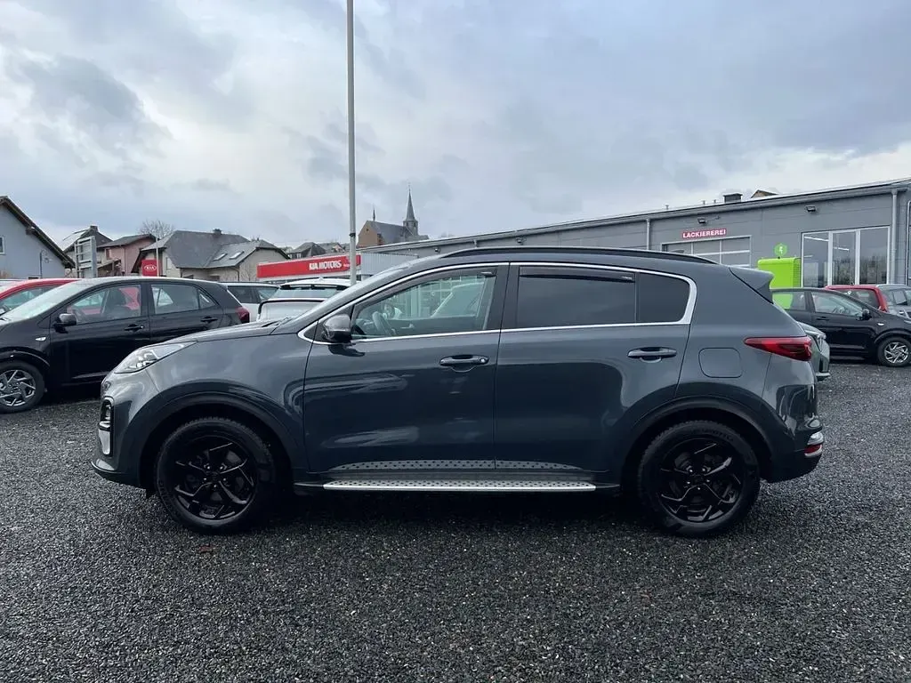 Gebraucht Kia Sportage 177 PS (130 kW) 2021 H8g) pentametal met. (grau SUV