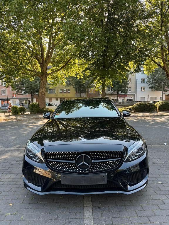 Schwarz Gebraucht 2014 Mercedes C220 AMG line Limousine | 16.799 € (Teuer) - Bild 1/4