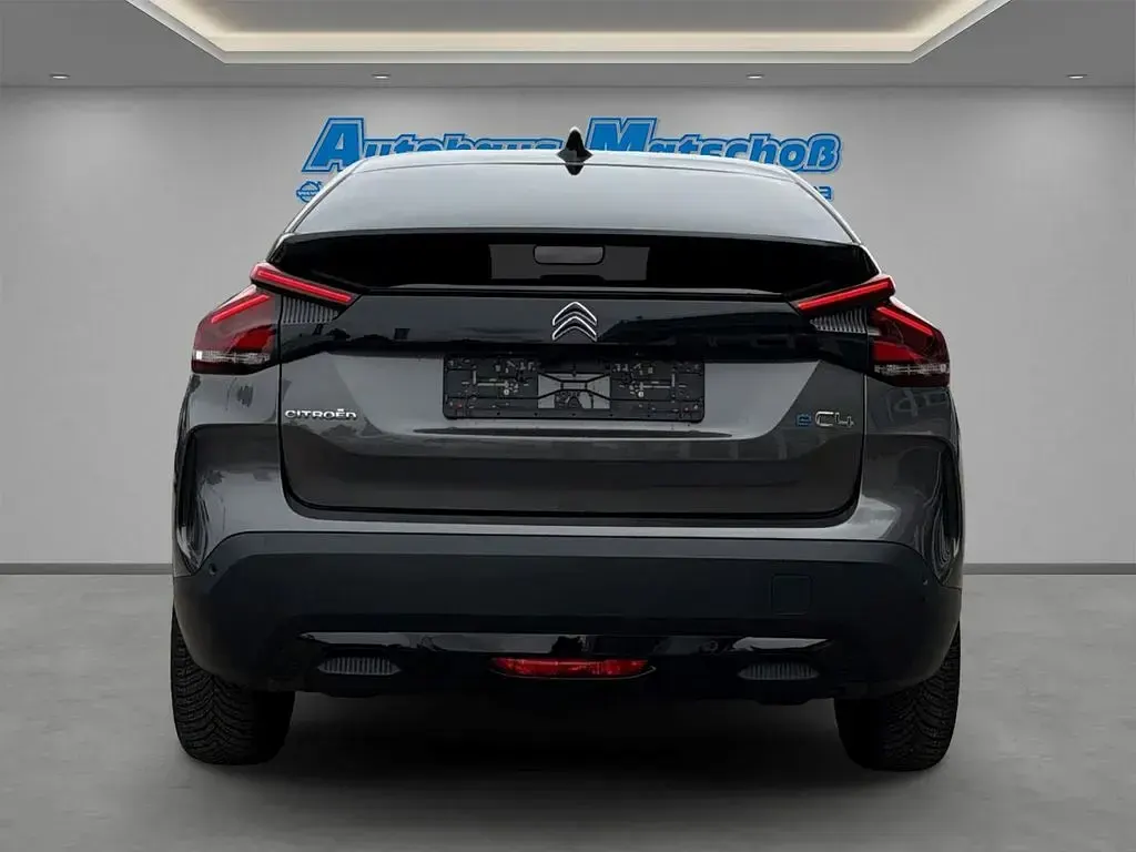 Gebraucht Citroën e-C4 Shine 100 kW (136 PS) 2023 Lackierung platiniumgrau/typ Limousine
