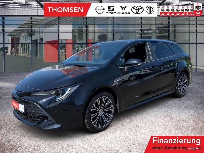 Black mica / ink Gebraucht 2021 Toyota Corolla Team Kombi | 24.285 € (Fairer Preis) - Bild 1/3
