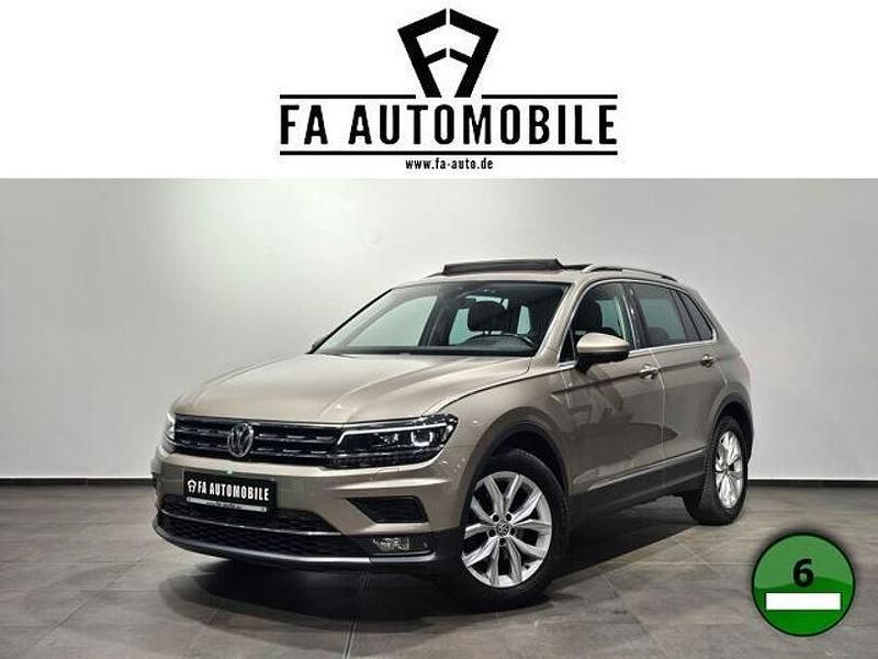 Titanium beige metalli (metallic) Gebraucht 2018 VW Tiguan Highline SUV | 24.890 € (Fairer Preis) - Bild 1/4