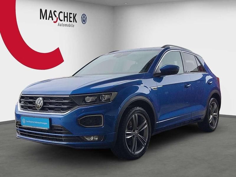 Ravennablau Gebraucht 2021 VW T-Roc R-line SUV | 25.220 € (Superpreis) - Bild 1/4