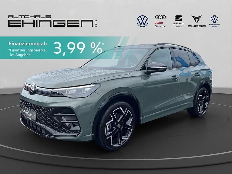 Cipressinogrün metallic Gebraucht 2024 VW Tiguan R-line SUV | 42.777 € (Etwas zu teuer) - Bild 1/3