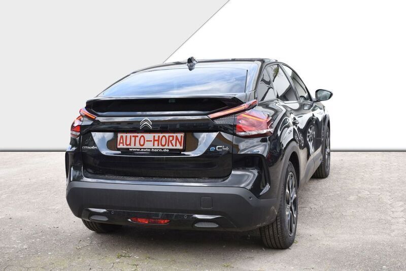 Gebraucht Citroën e-C4 Shine 100 kW (136 PS) 2024 Perla nera schwarz metallic Limousine