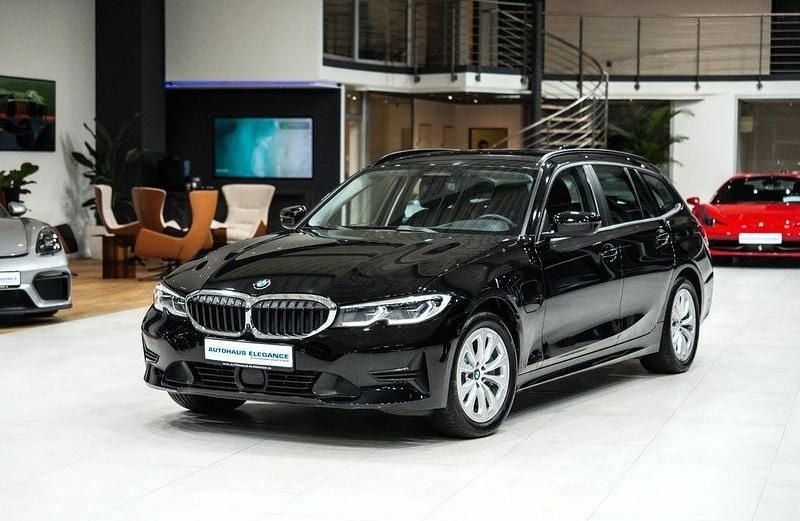 Schwarz ii Gebraucht 2020 BMW 330e Advantage Kombi | 23.980 € (Fairer Preis) - Bild 1/4