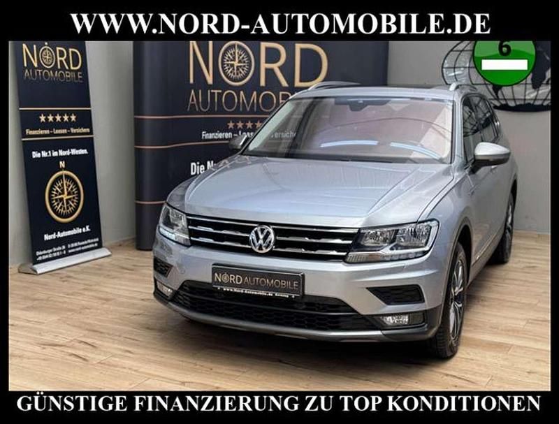 Pyritsilber metallic (metallic) Gebraucht 2021 VW Tiguan Allspace Comfortline SUV | 21.980 € (Superpreis) - Bild 1/3