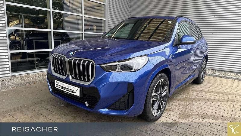 M portimao blau metallic Gebraucht 2024 BMW X1 Comfort Edition SUV | 51.899 € - Bild 1/4