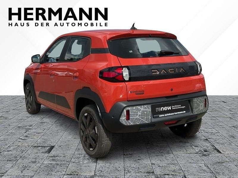Gebraucht Dacia Spring Extreme 47 kW (65 PS) 2025 Brick red (rot) Kleinwagen
