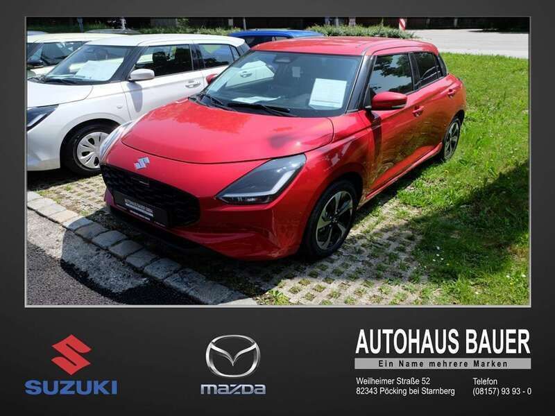 Burning red pearl met Neu 2025 Suzuki Swift Comfort+ Kleinwagen | 21.890 € - Bild 1/4