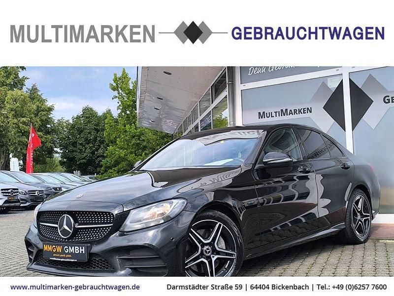 Schwarz/baltic black Gebraucht 2021 Mercedes C300e AMG line Limousine | 20.490 € - Bild 1/4