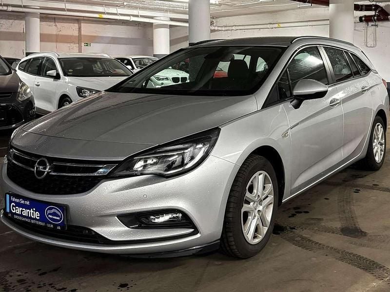 Grau Gebraucht 2016 Opel Astra Edition Kombi | 8.550 € (Fairer Preis) - Bild 1/4