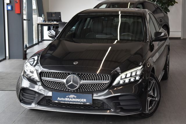 Grau Gebraucht 2020 Mercedes C300e AMG line Limousine | 21.550 € (Teuer) - Bild 1/4
