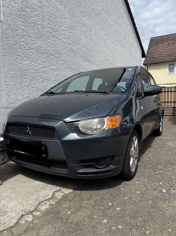 Grau Gebraucht 2009 Mitsubishi Colt Inform Van / Kleinbus | 3.899 € (Fairer Preis) - Bild 1/4