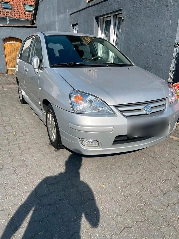 Grau Gebraucht 2004 Suzuki Liana Limousine | 1.699 € (Teuer) - Bild 1/4