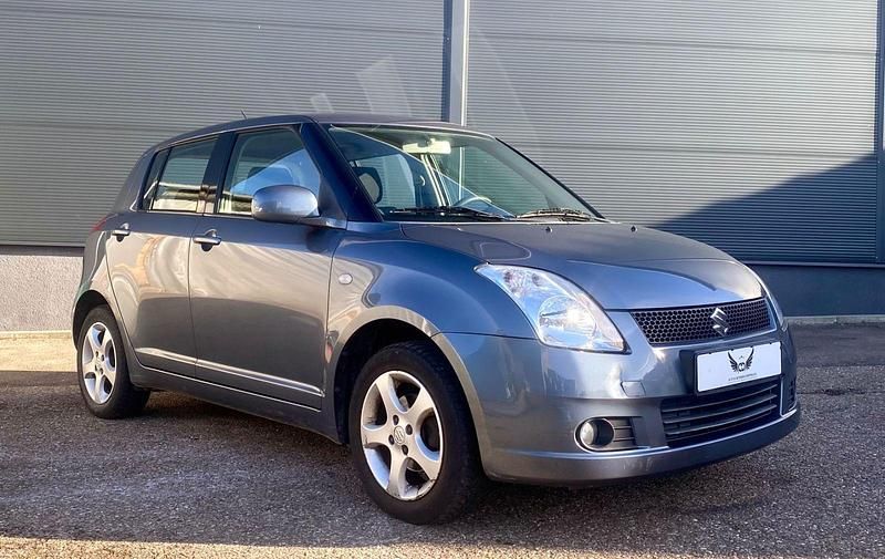 Grau Gebraucht 2006 Suzuki Swift Snow Kleinwagen | 3.780 € (Fairer Preis) - Bild 1/4