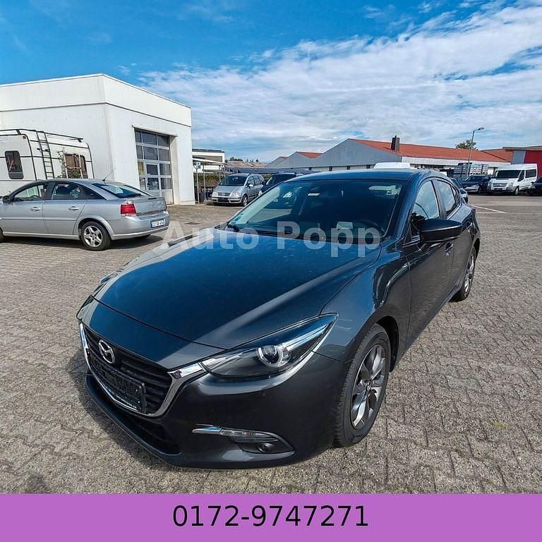 Grau Gebraucht 2017 Mazda 3 Exclusive-Line Limousine | 9.499 € (Fairer Preis) - Bild 1/4