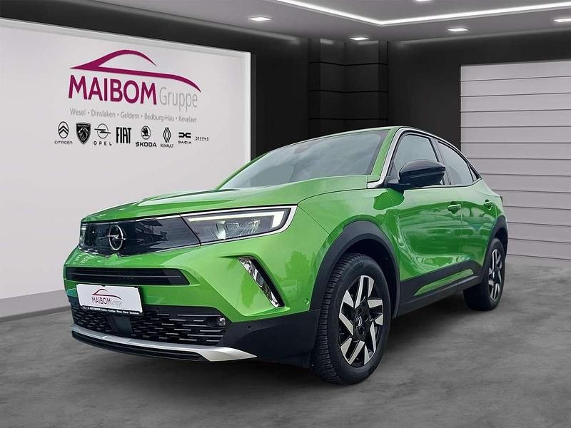 Matcha green/ikone gruen Gebraucht 2022 Opel Mokka Elegance SUV | 16.945 € (Fairer Preis) - Bild 1/4
