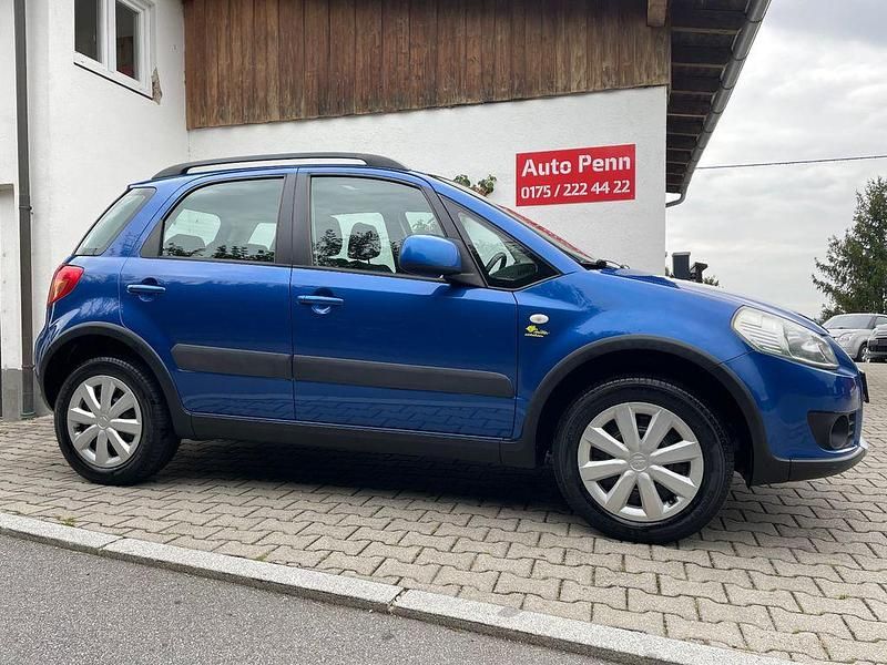 Blau Gebraucht 2009 Suzuki SX4 Club SUV | 6.990 € (Fairer Preis) - Bild 1/4
