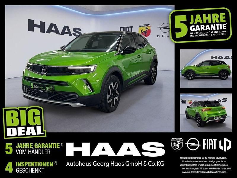 Matcha green/ikone gruen (metallic) Gebraucht 2022 Opel Mokka-e Elegance SUV | 17.380 € (Fairer Preis) - Bild 1/4