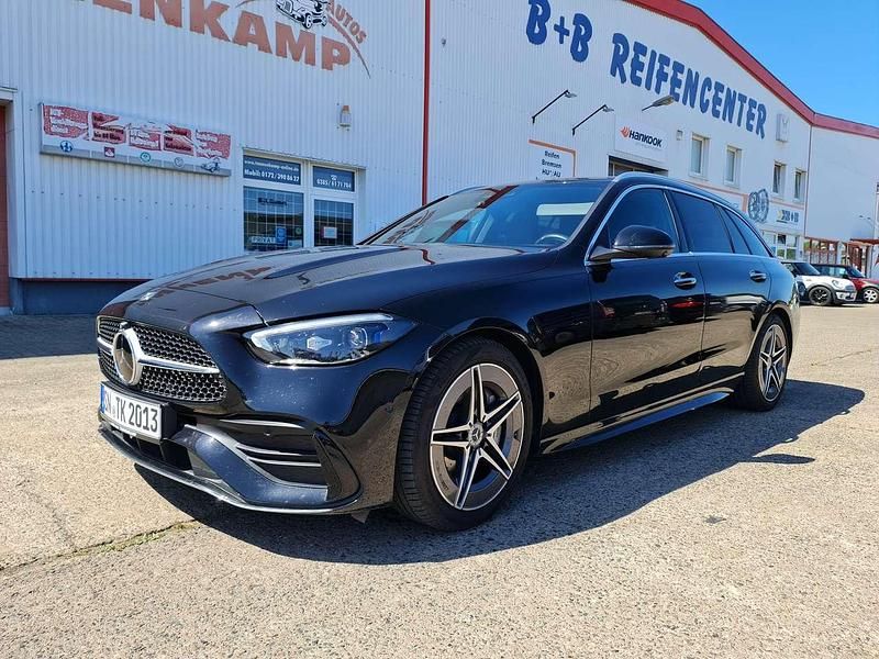 Obsidianschwarz metalliclack Gebraucht 2022 Mercedes C220 AMG line Kombi | 44.990 € - Bild 1/4