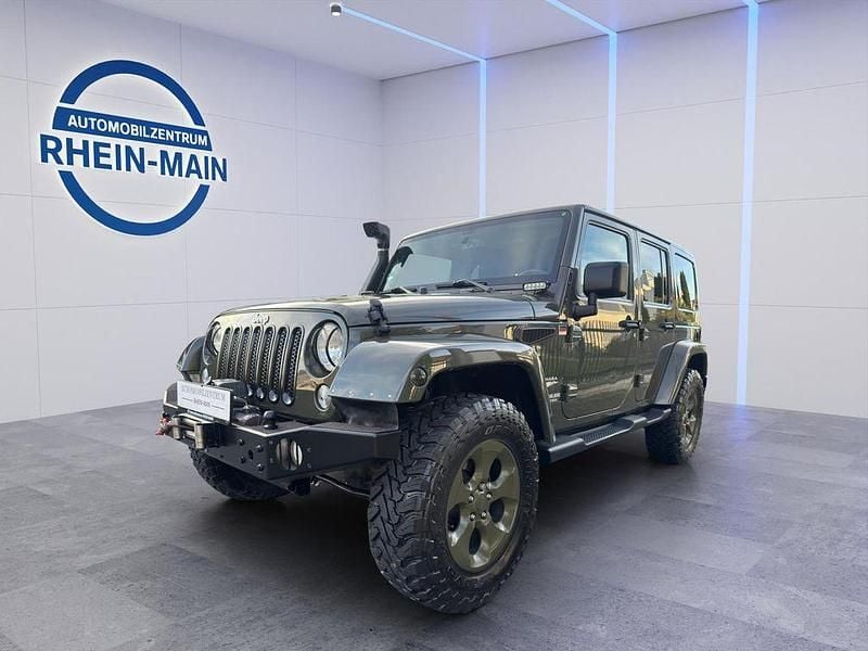 Grün Gebraucht 2016 Jeep Wrangler Sahara SUV | 33.900 € (Etwas zu teuer) - Bild 1/4