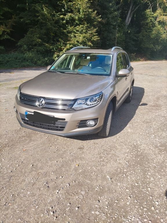Gold Gebraucht 2014 VW Tiguan Sportline SUV | 17.299 € - Bild 1/4