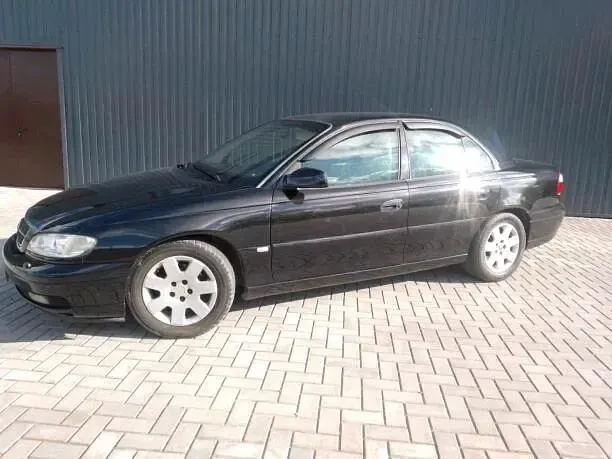 Second-hand Opel Omega 211 CP (155 kW) 1999 Negru Berlinǎ