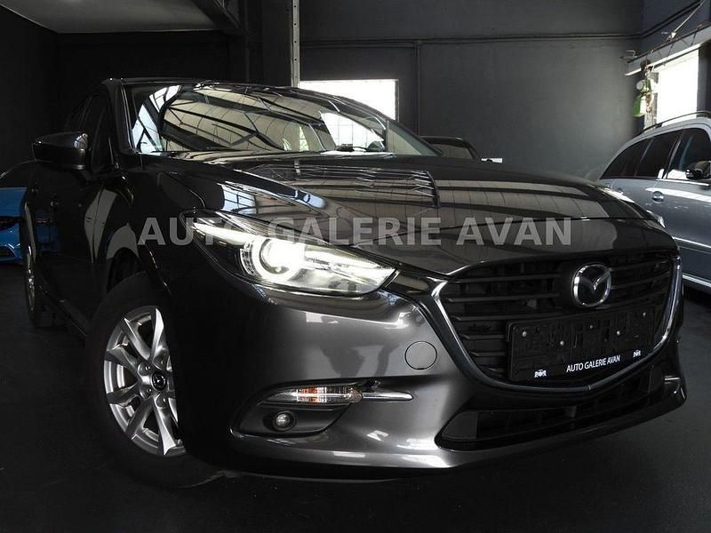 Grau Gebraucht 2017 Mazda 3 Exclusive-Line Limousine | 13.500 € (Fairer Preis) - Bild 1/4