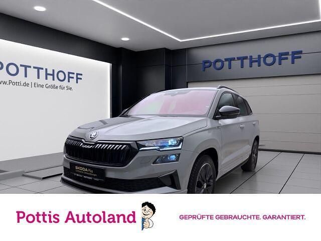 Grau Gebraucht 2024 Skoda Karoq SportLine SUV | 36.977 € (Guter Preis) - Bild 1/4