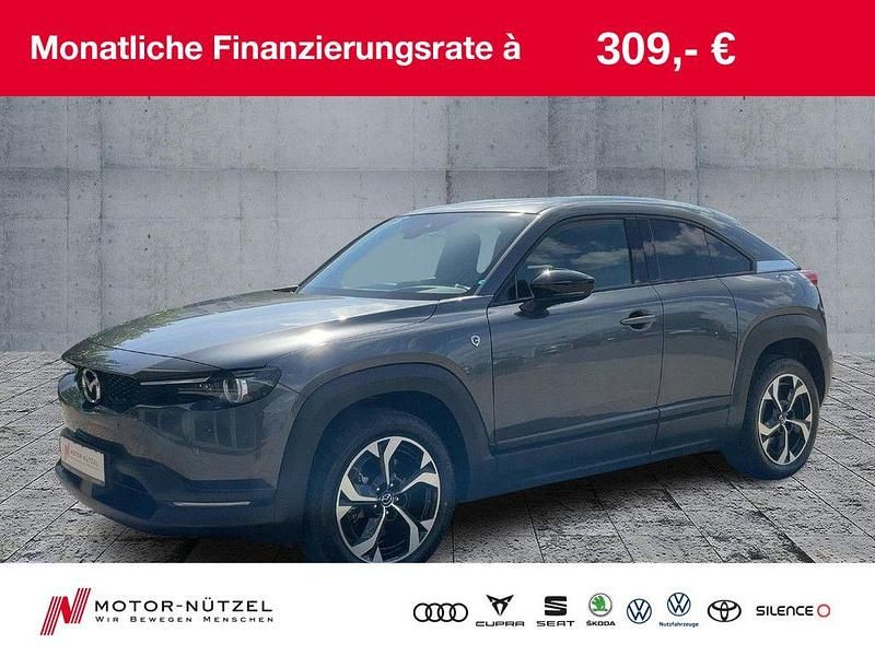 Machine gray Gebraucht 2023 Mazda MX30 Ad'Vantage SUV | 22.990 € (Guter Preis) - Bild 1/4