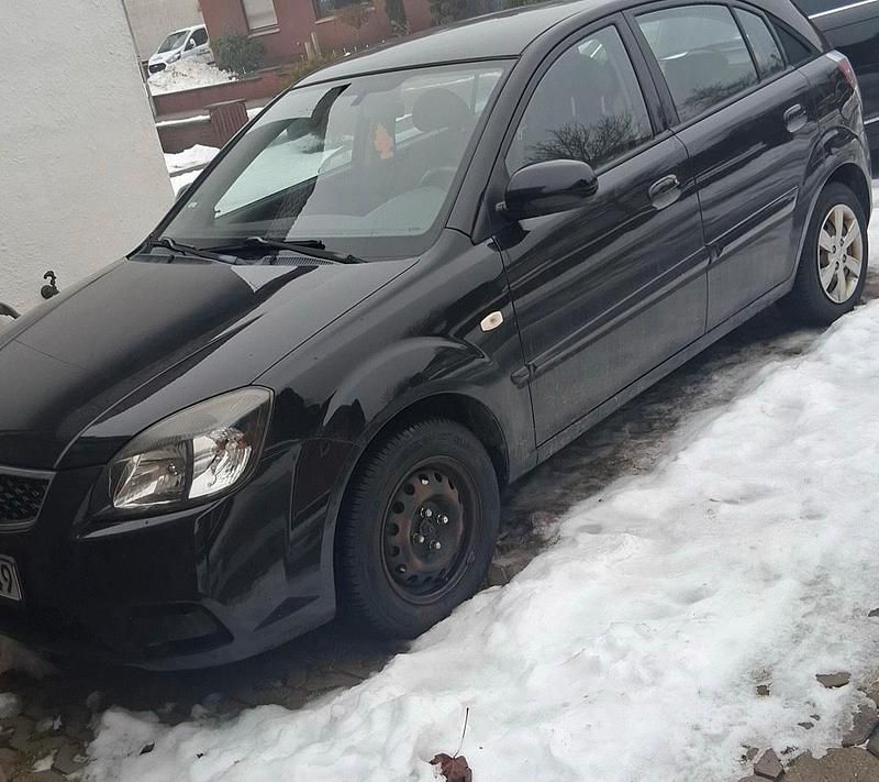 Gebraucht Kia Rio 96 PS (70 kW) 2010 Schwarz Kleinwagen