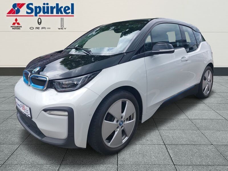 Capparisweiss mit akzent blau Gebraucht 2018 BMW i3 Comfort Edition Kleinwagen | 16.780 € (Fairer Preis) - Bild 1/4