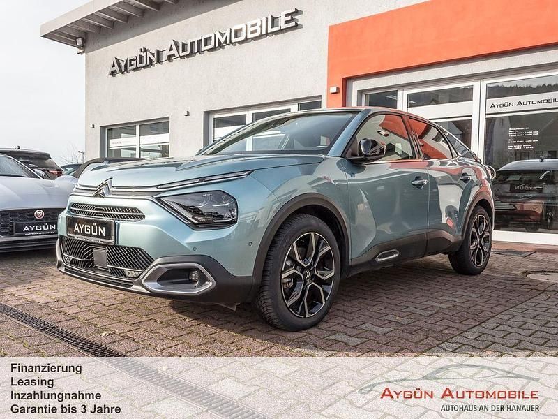 Islandblau metallic Gebraucht 2024 Citroën e-C4 Shine Limousine | 18.995 € (Superpreis) - Bild 1/4